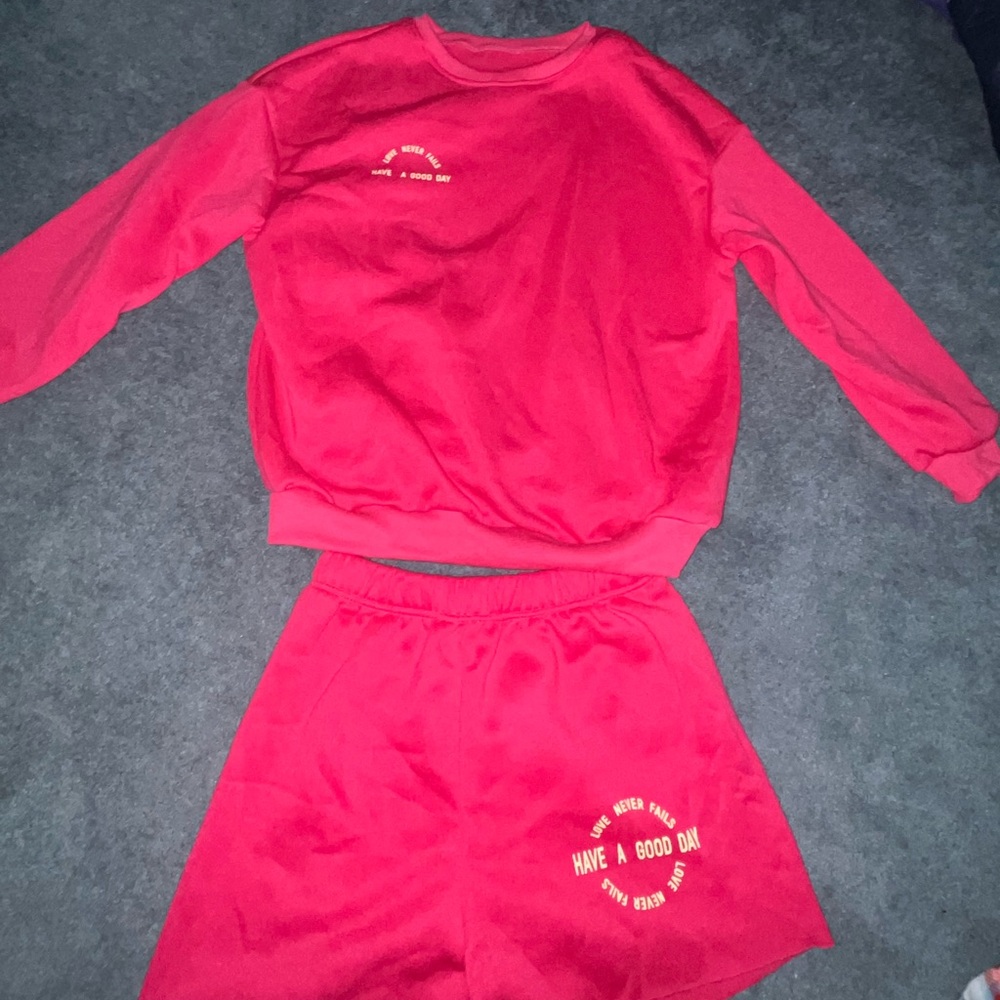 Bright pink sweat set
“Love never fails, have a good day”